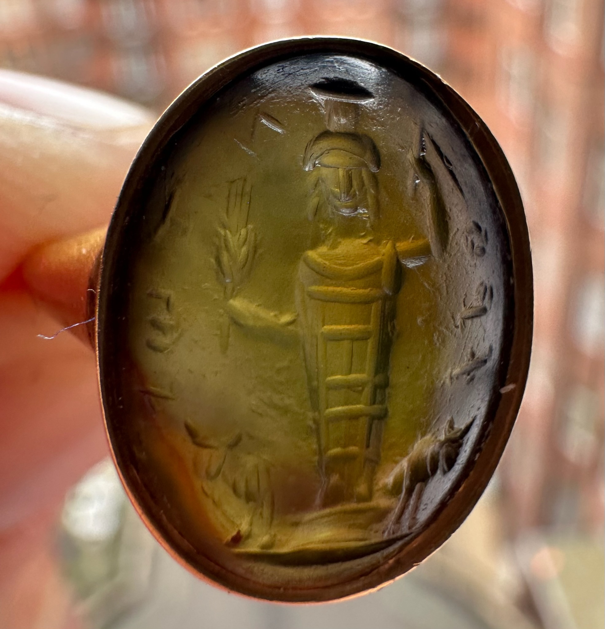 A gold Signet Ring set with a Roman Magical Prasium Intaglio. Jupiter Heliopolitanus
