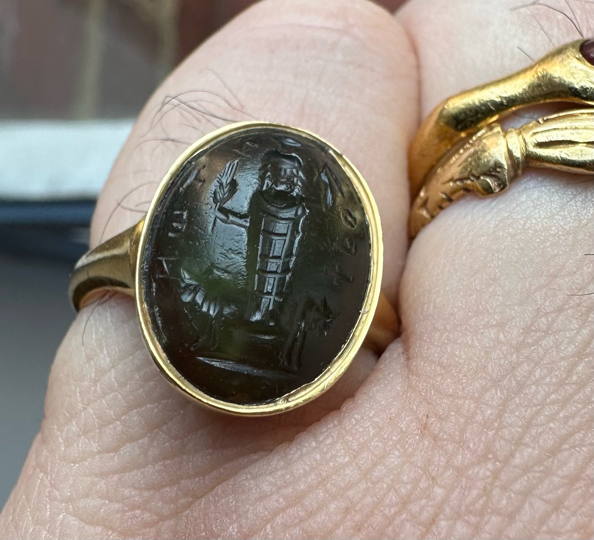 A gold Signet Ring set with a Roman Magical Prasium Intaglio. Jupiter Heliopolitanus