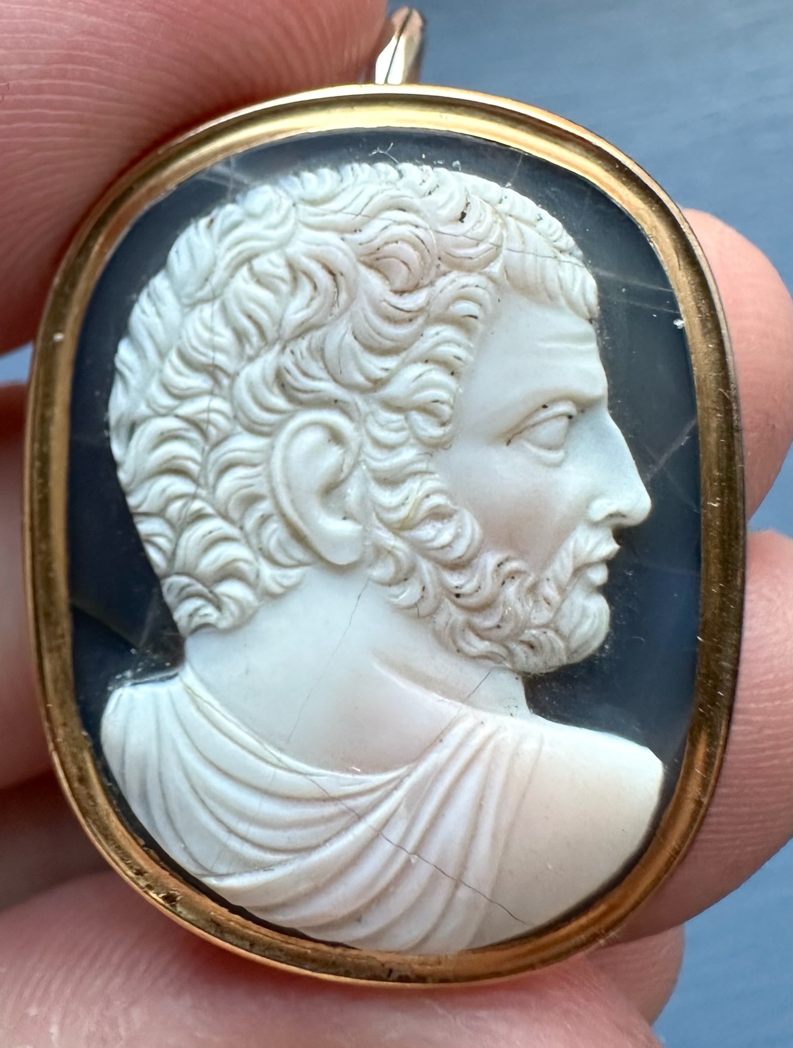 A Grand Tour two-layer agate cameo of a bearded man after the emperor Caracalla, set as a gold pendant.