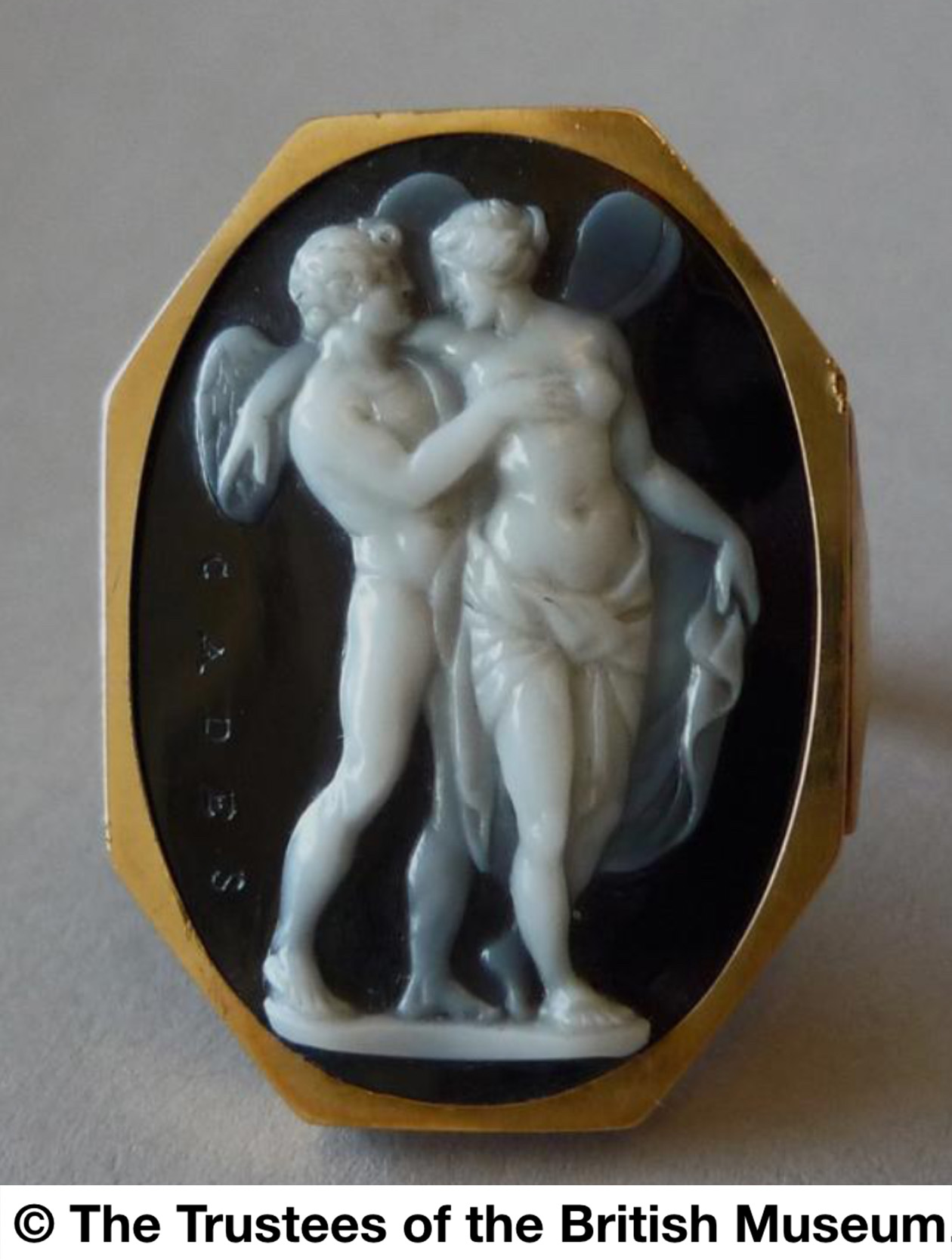 Grand Tour, Late 18th century, A Grand Tour three-layered agate cameo mounted in a gold pendant. Cupid and Psyche.  (Late 18th century )