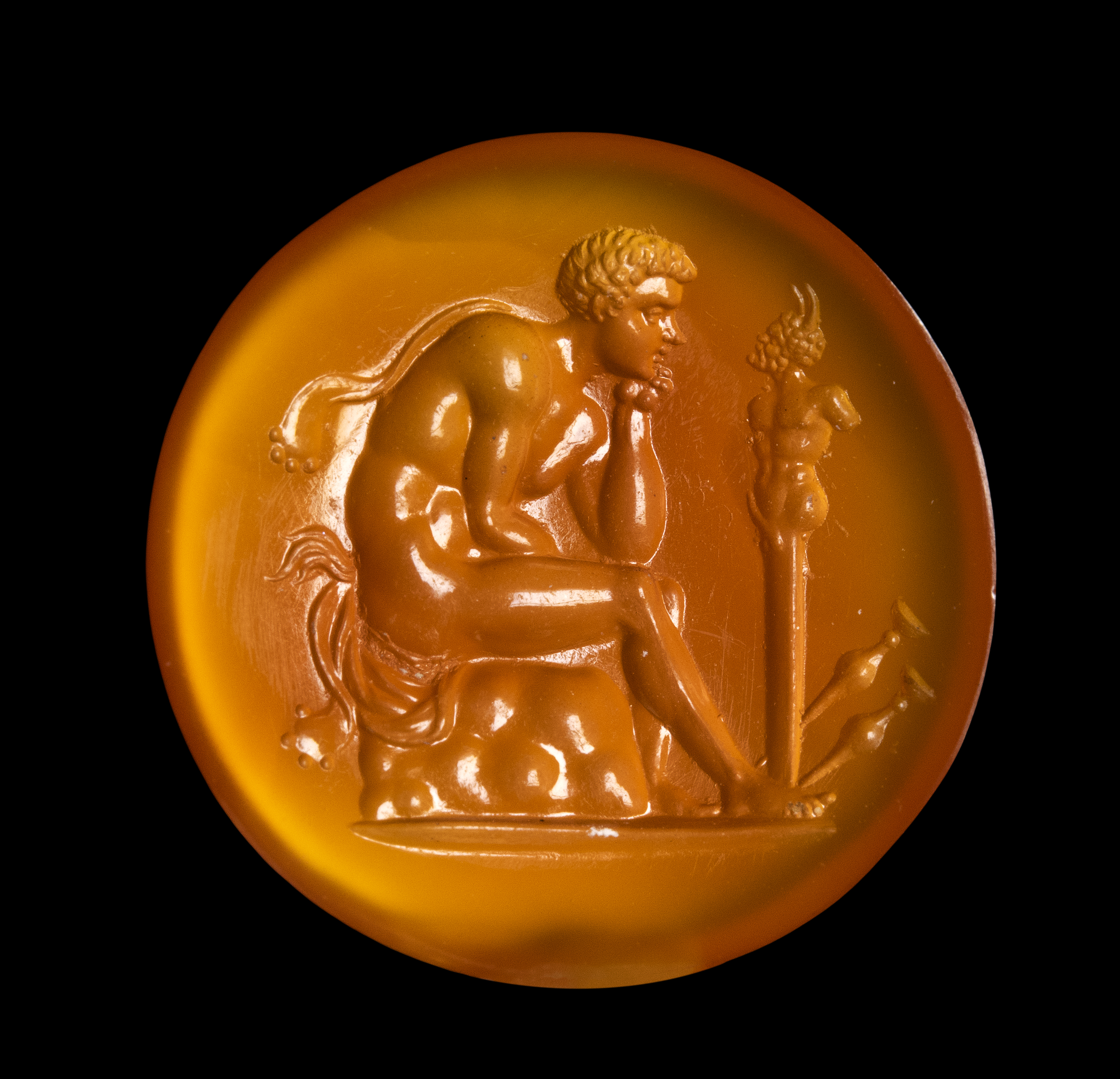 A Grand Tour Carnelian Intaglio A Young Faun Seated before a Herm of Pan