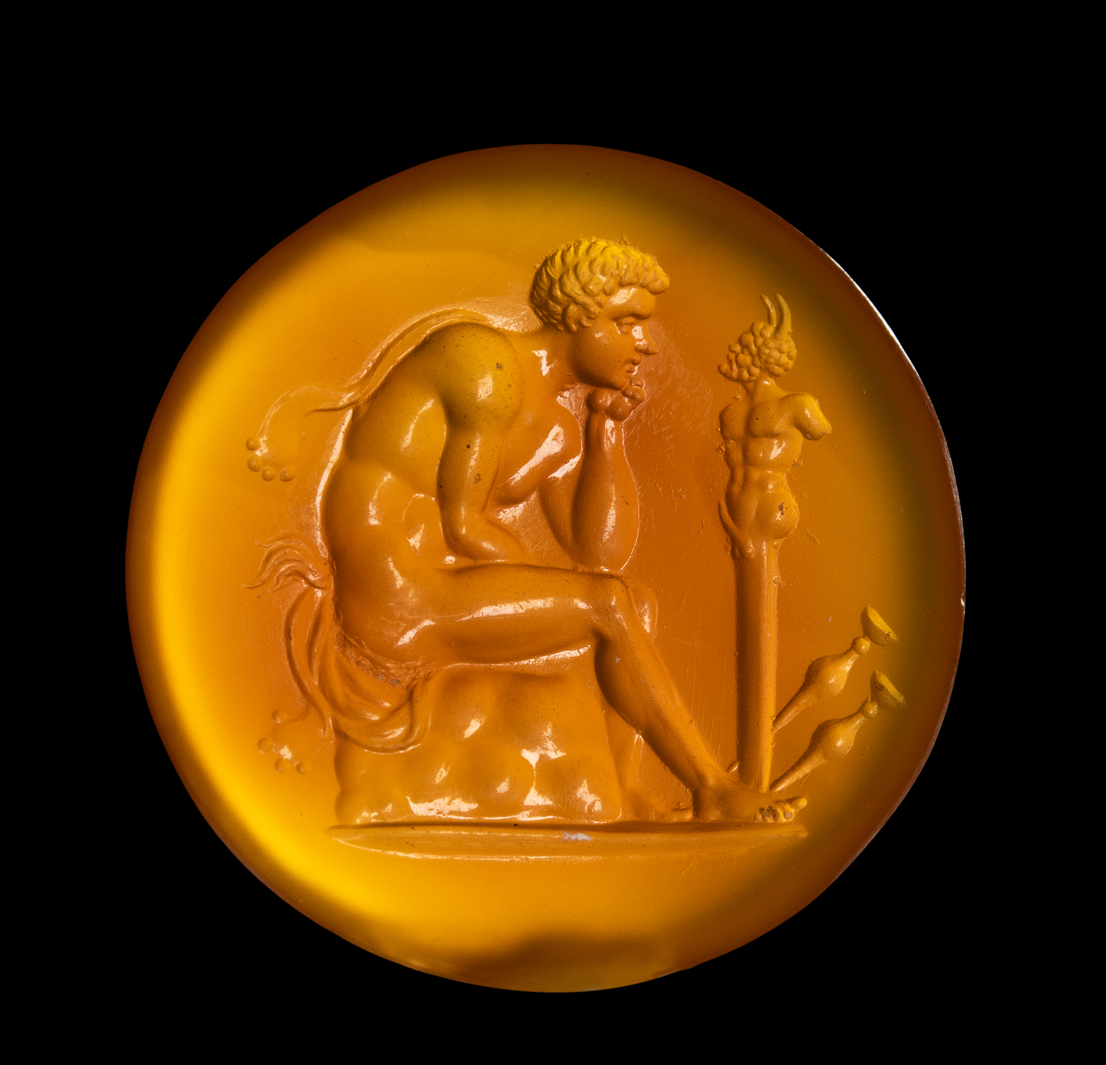 A Grand Tour Carnelian Intaglio A Young Faun Seated before a Herm of Pan