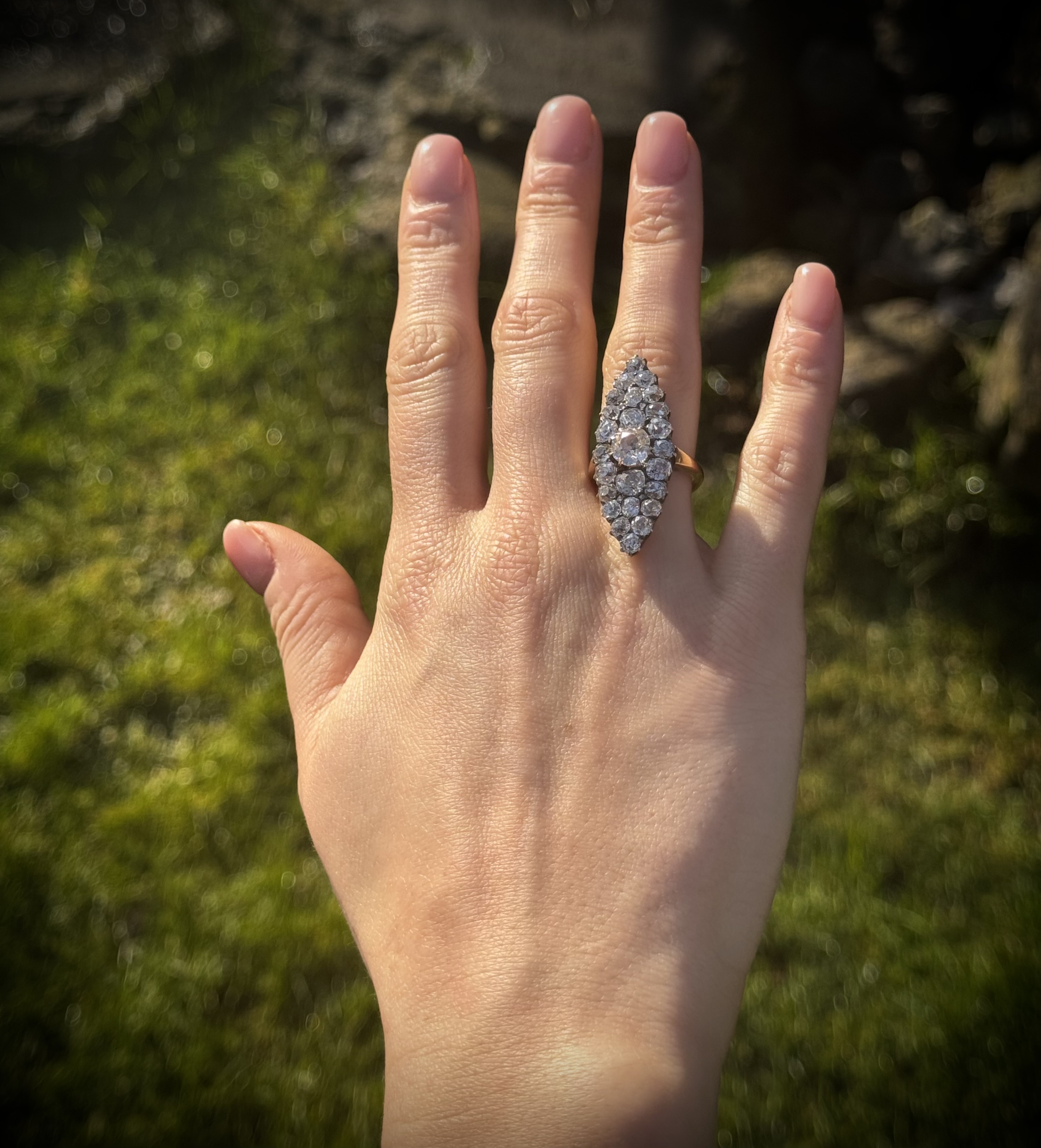 A Late 19th century Navette Cluster gold ring with diamonds.