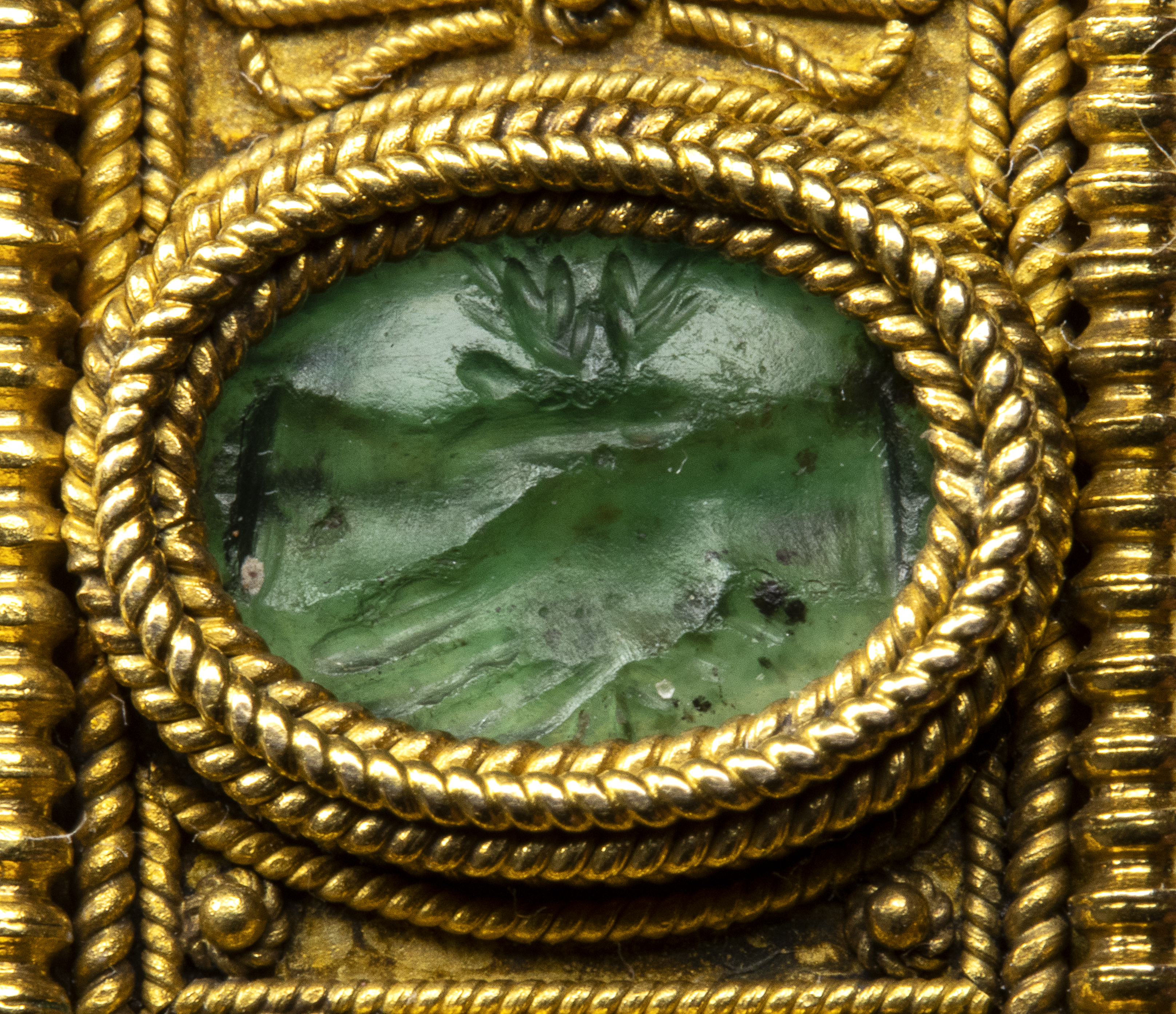 19th century, An Etruscan Revival gold brooch set with Roman green chalcedony intaglios.