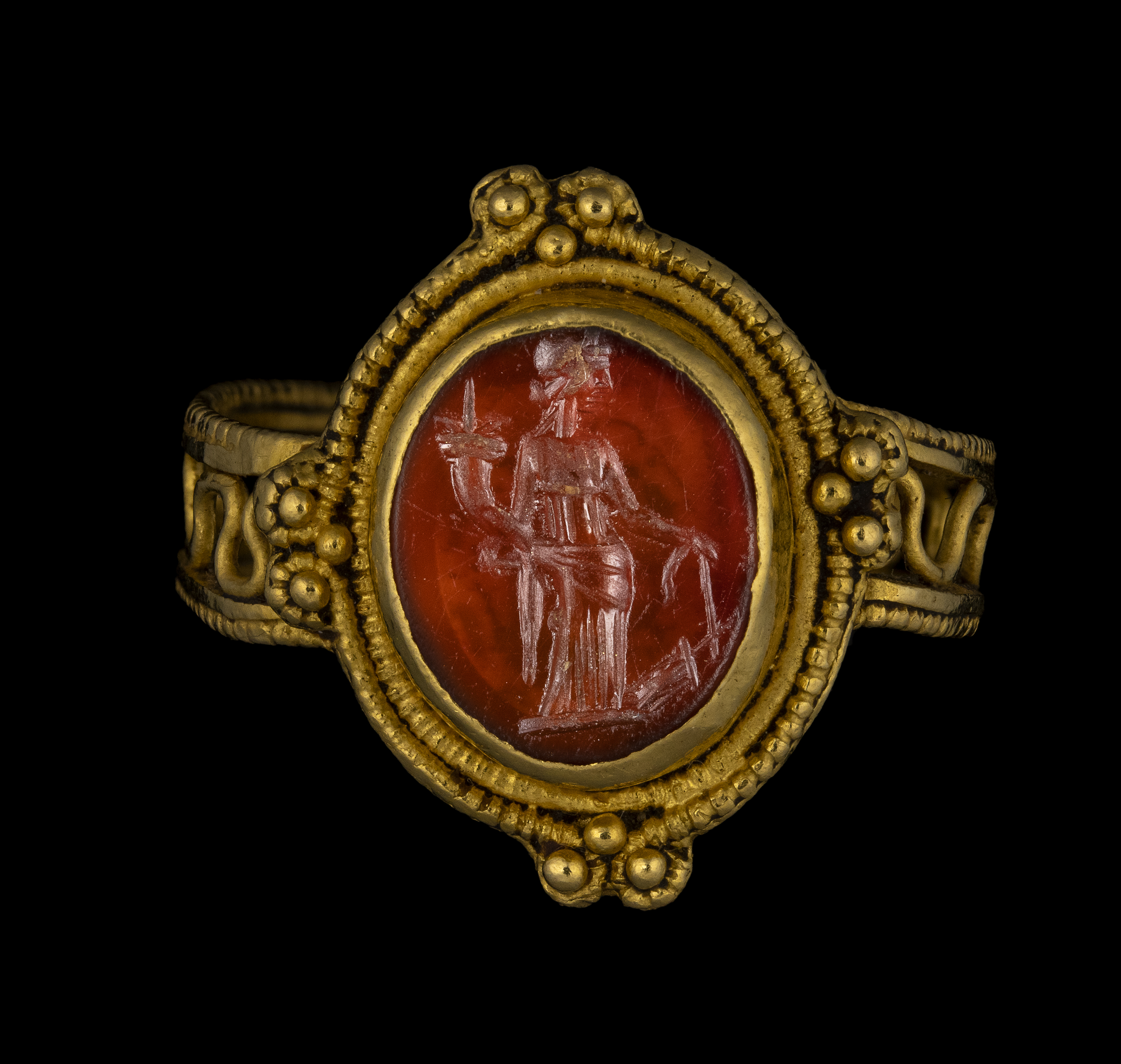 Late roman, A Late Roman gold ring set with a carnelian intaglio. Tyche.  (4th century A.D.)