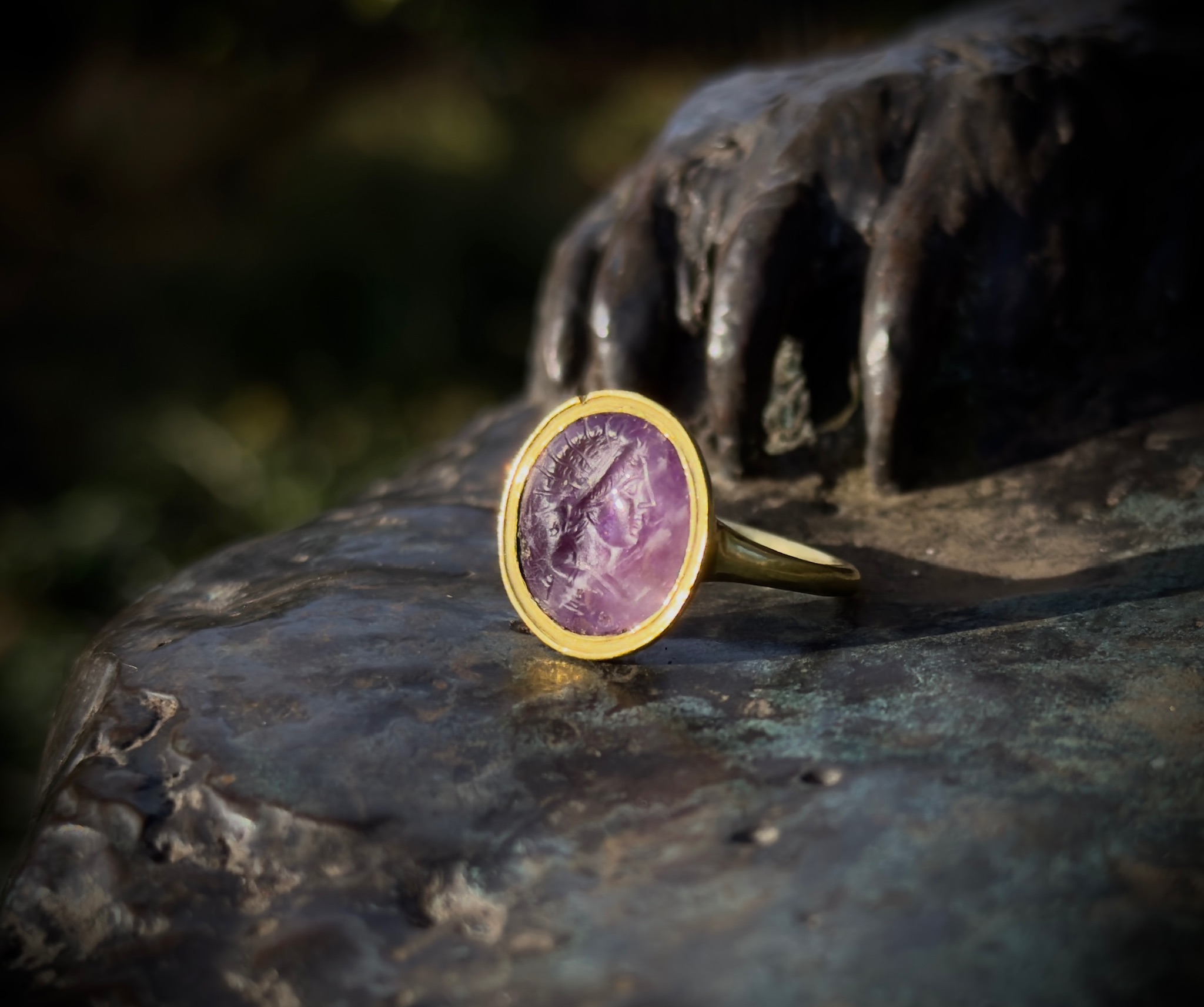 Roman imperial, A Roman amethyst intaglio set in a later gold ring. Head of Helios.  (1st-2nd century A.D. )