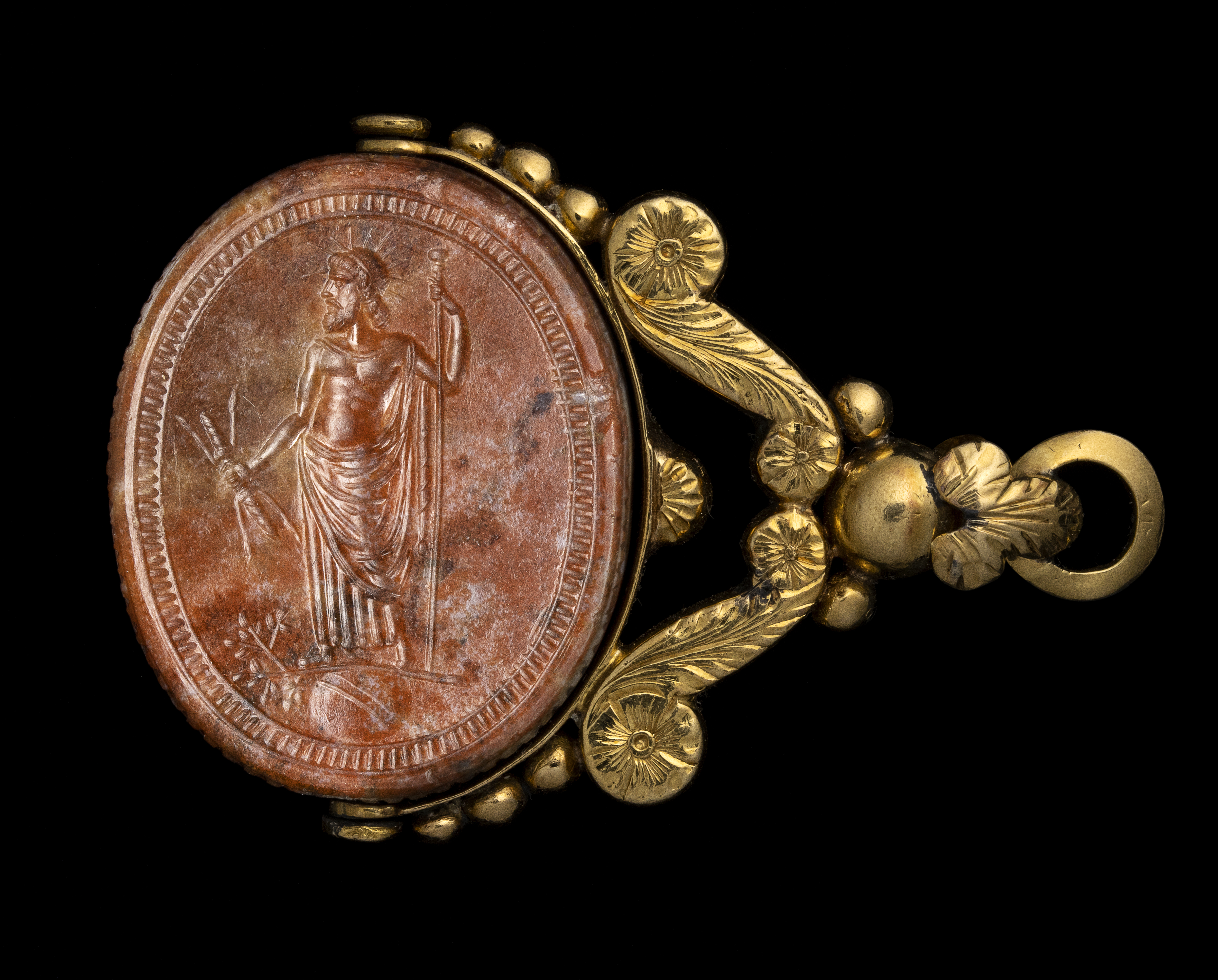 A late 18th c. gold swivel chiseled seal pendant set with a large red jasper engraved scarab. Jupiter.