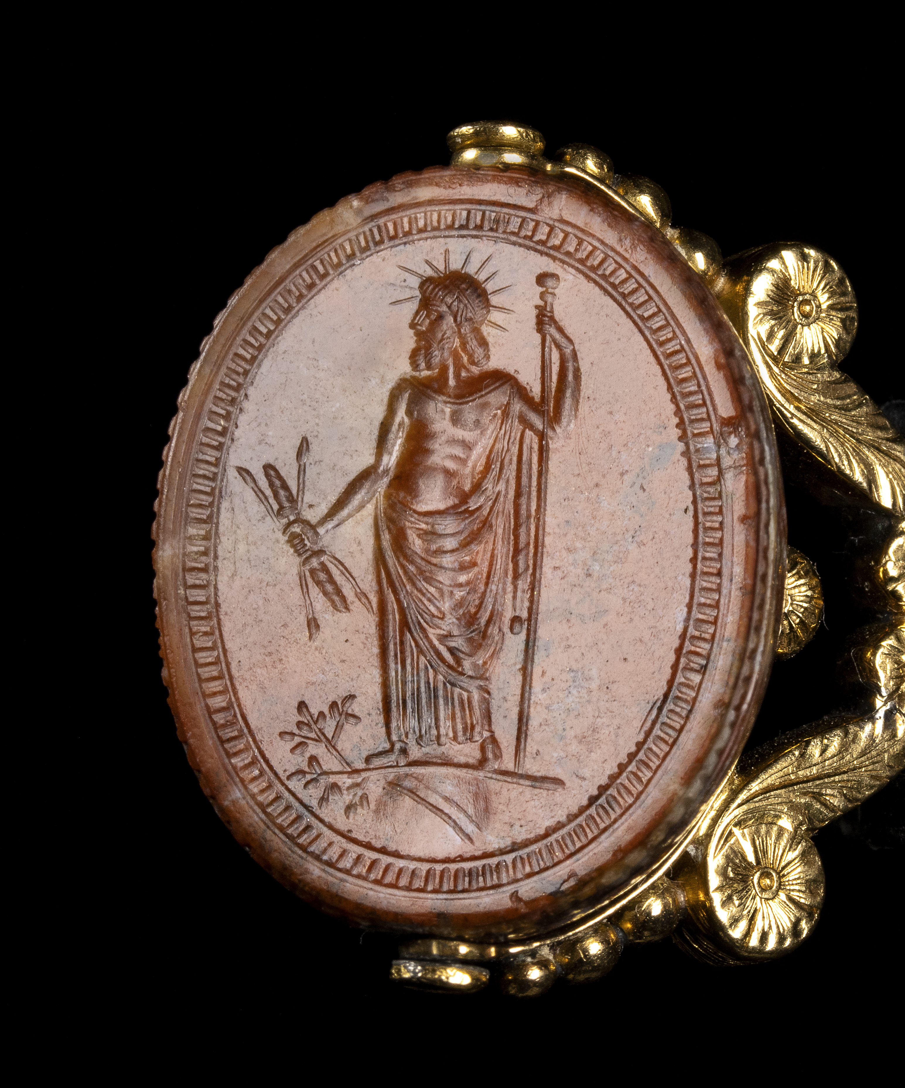 A late 18th c. gold swivel chiseled seal pendant set with a large red jasper engraved scarab. Jupiter.