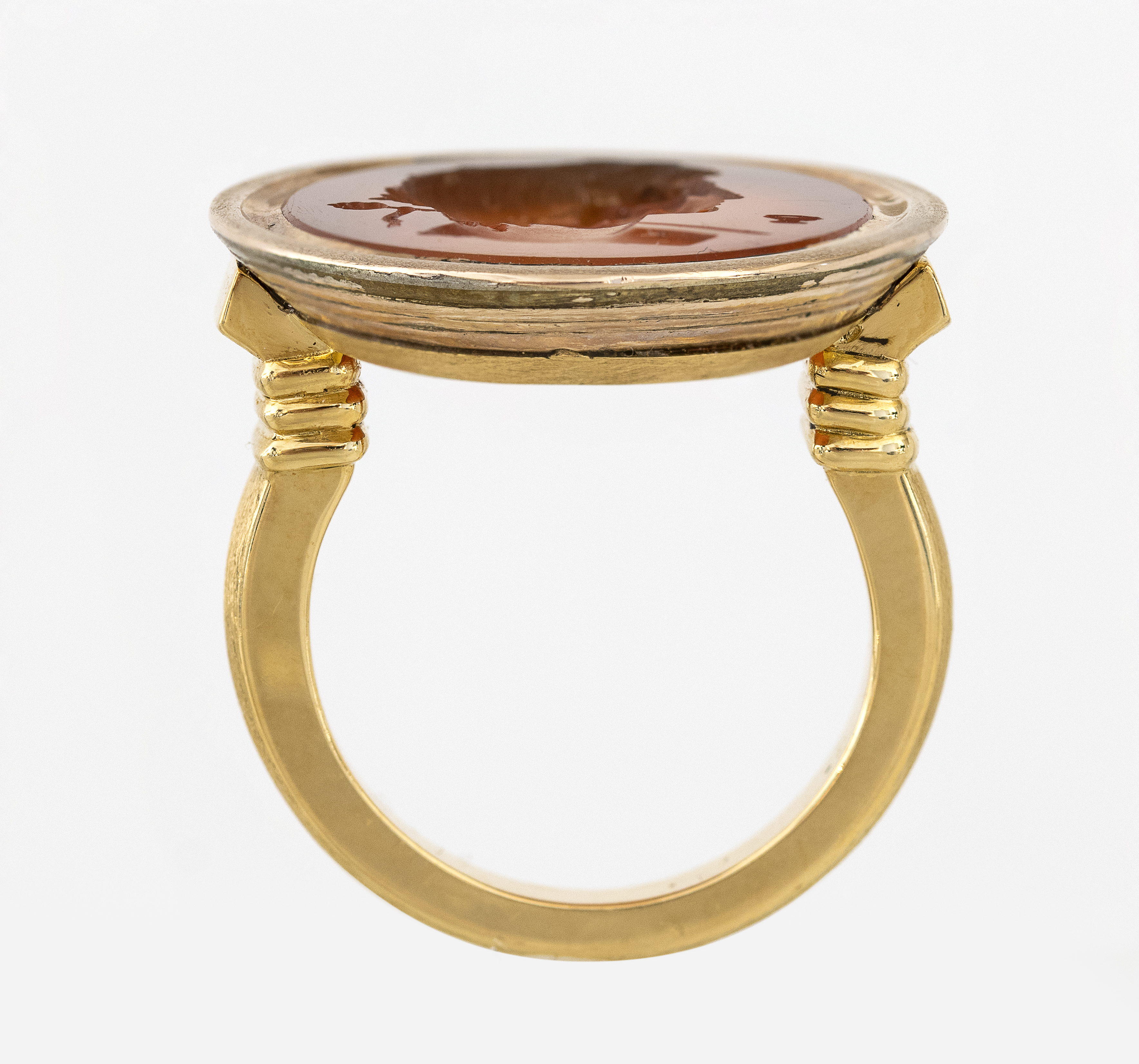 Neoclassical, A modern gold ring set with a Neoclassical carnelian intaglio. Bust of Bacchante.  (Early 19th century)