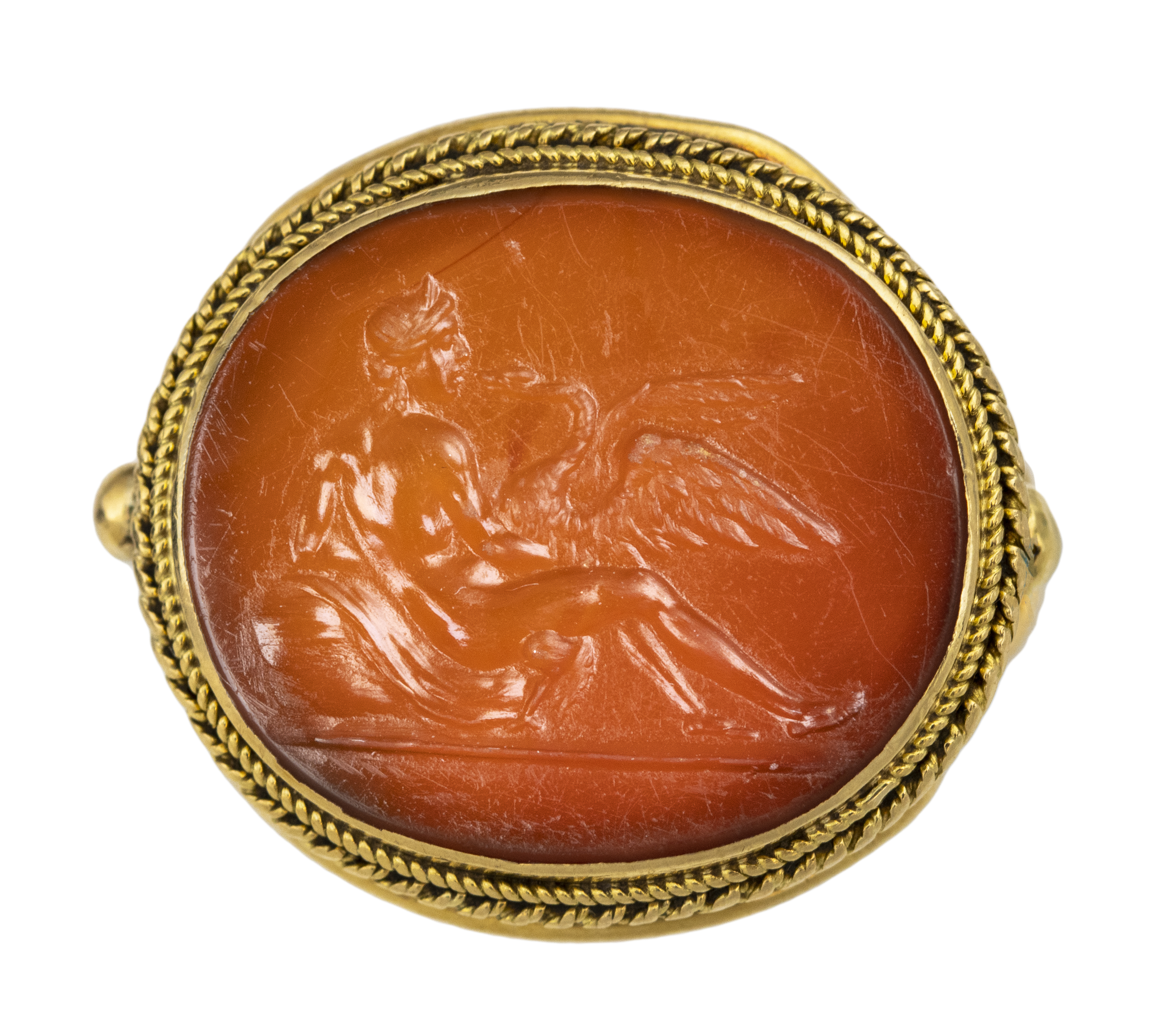 Neoclassical, Attributed to Carlo Costanzi (1705-1781). A gold ring with a Neoclassical carnelian intaglio. Leda and the swan. (Second half of the 18th century)