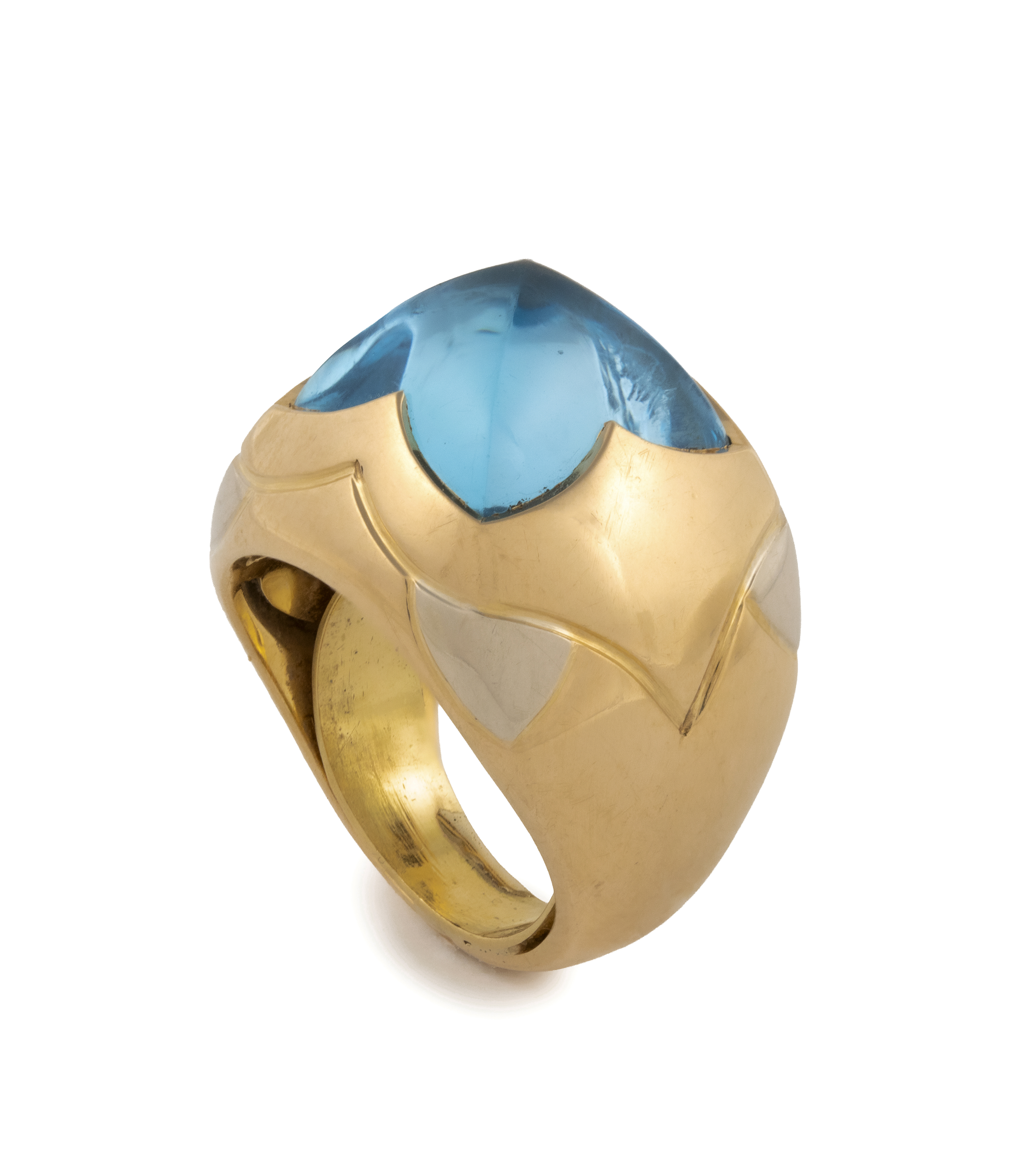 Bulgari. A blue topaz and gold demi-parure— a pair of ear clips and a ring en suite