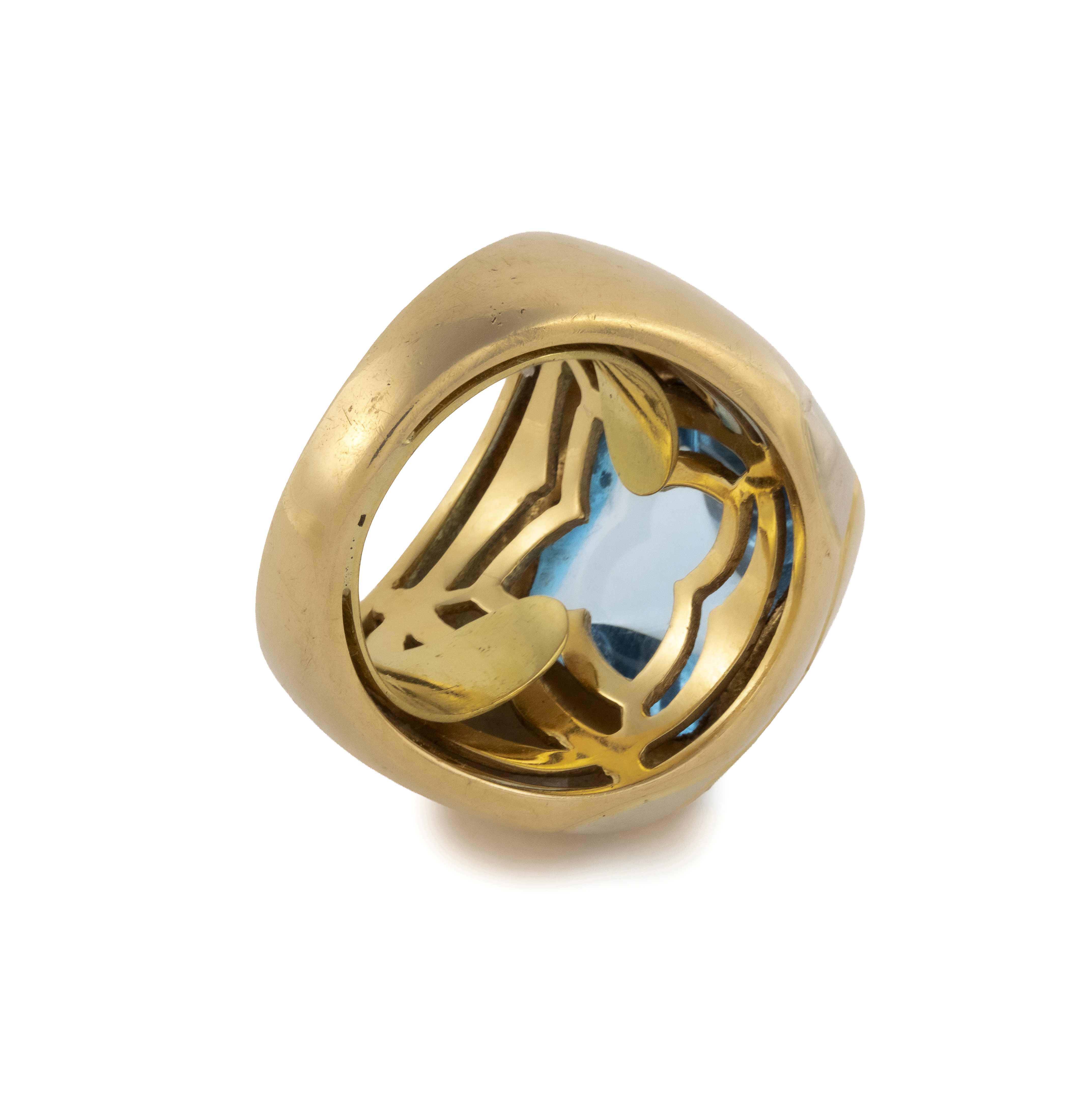 Bulgari. A blue topaz and gold demi-parure— a pair of ear clips and a ring en suite