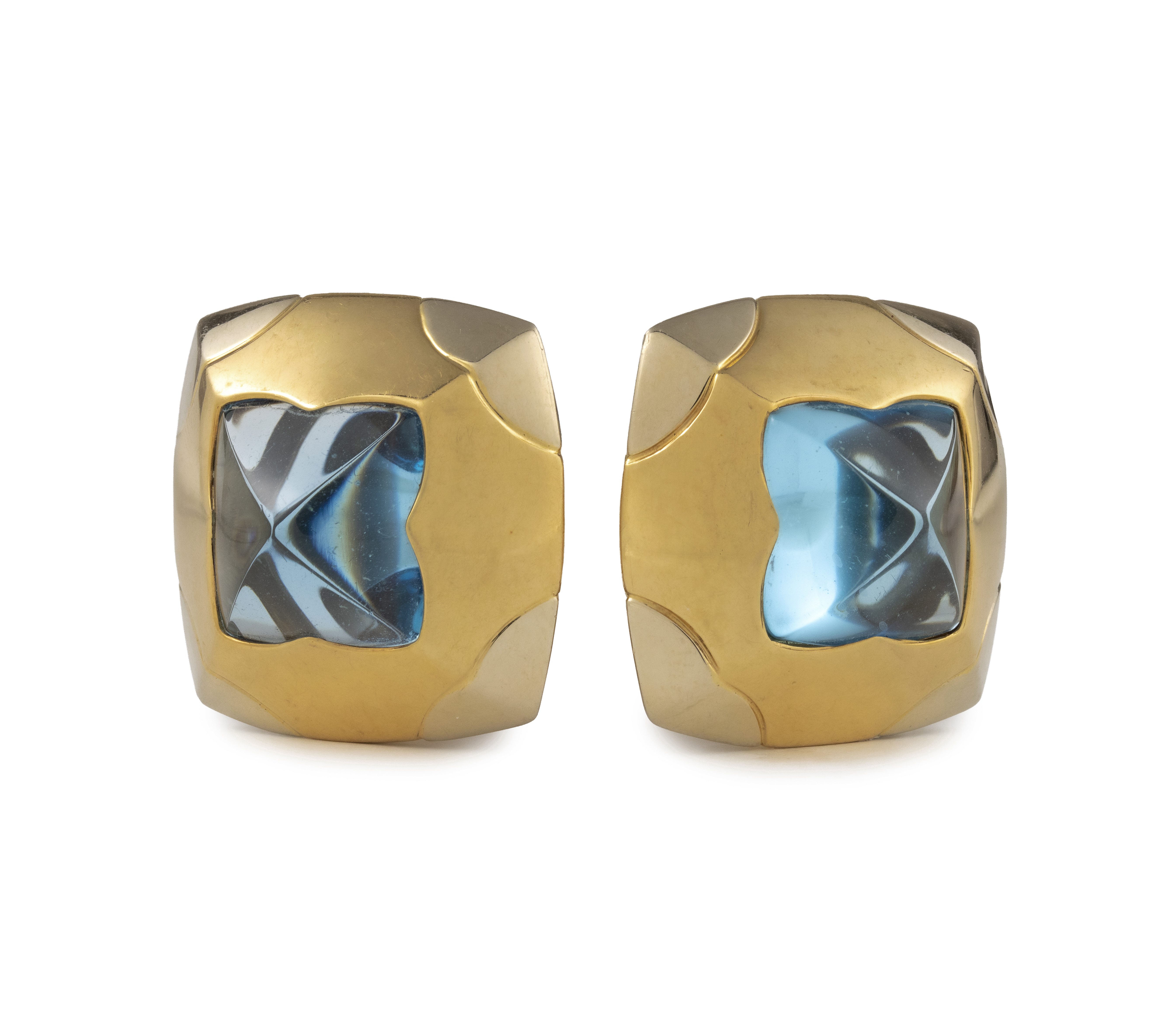 Bulgari. A blue topaz and gold demi-parure— a pair of ear clips and a ring en suite