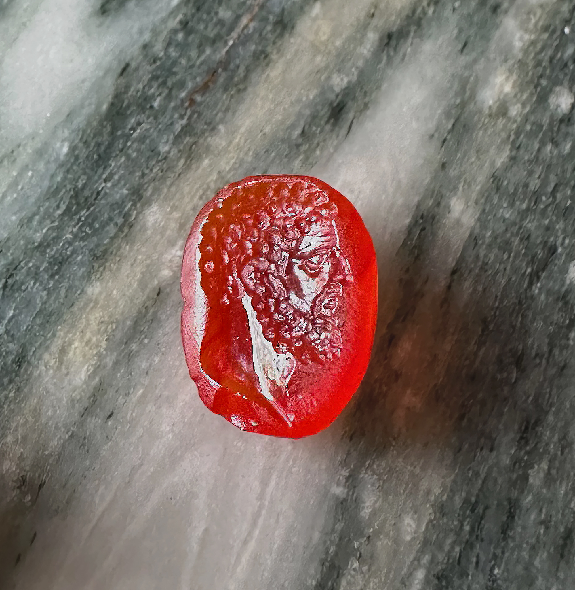 A Roman imperial carnelian intaglio. Portrait of Hercules.