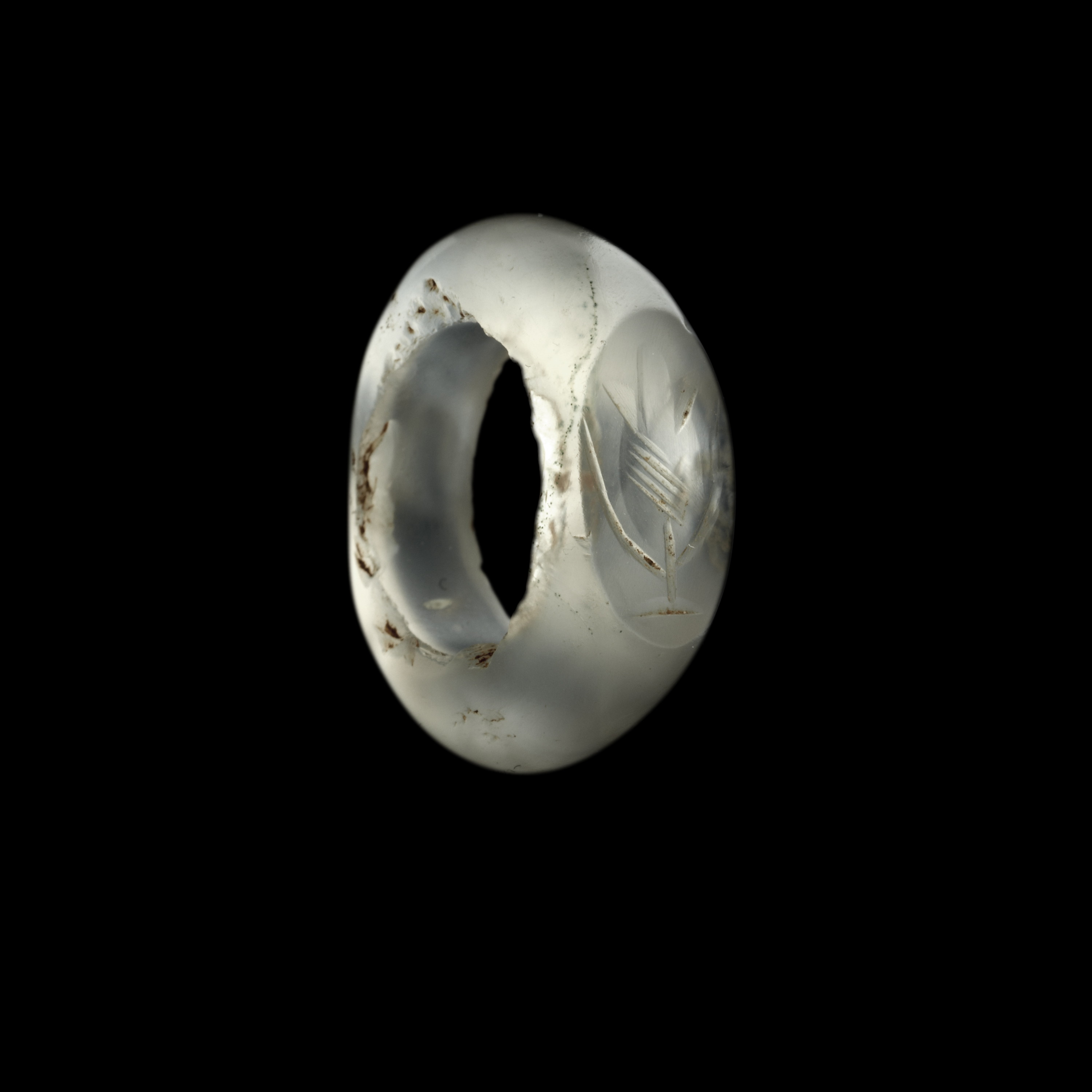 A Sasanian hololithic chalcedony seal ring. Flower.