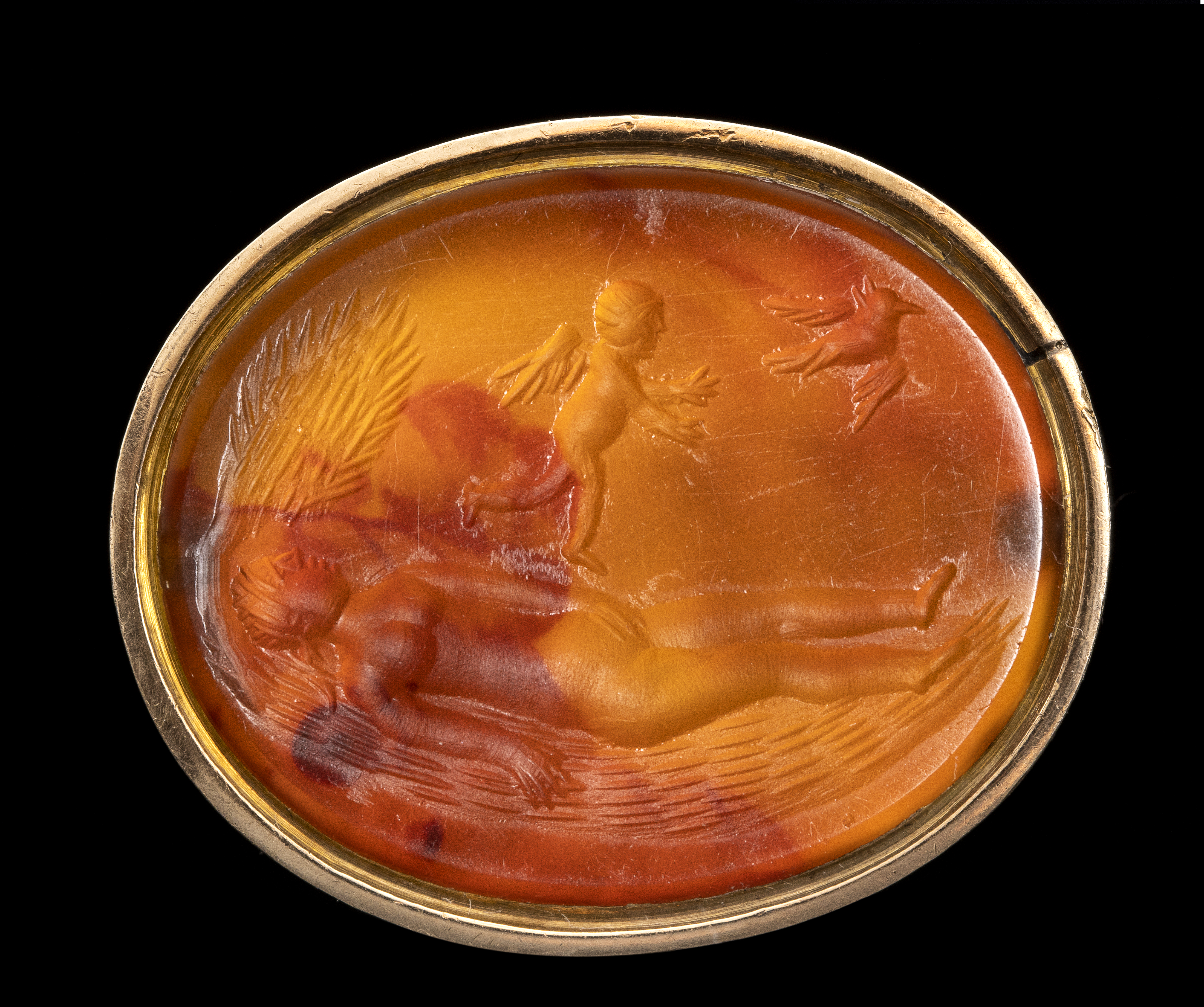 A English Georgian Era gold seal with an engraved carnelian. Allegorical scene of the soul. (18th century)