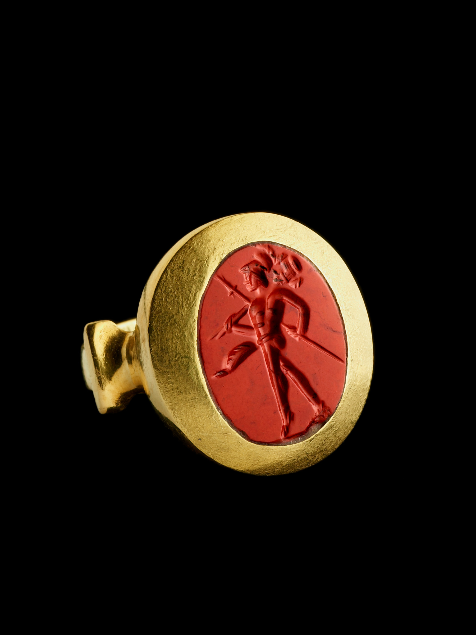 A high carat gold ring set with a Roman red jasper intaglio. Mars Gradivus