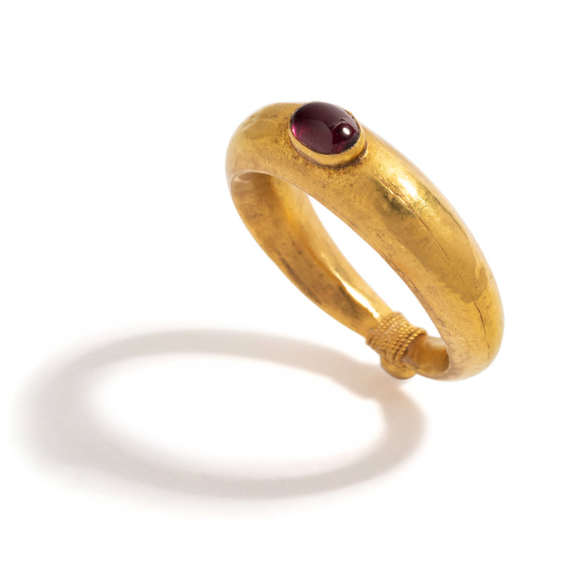 A Roman Gold and Garnet Cabochon ring.