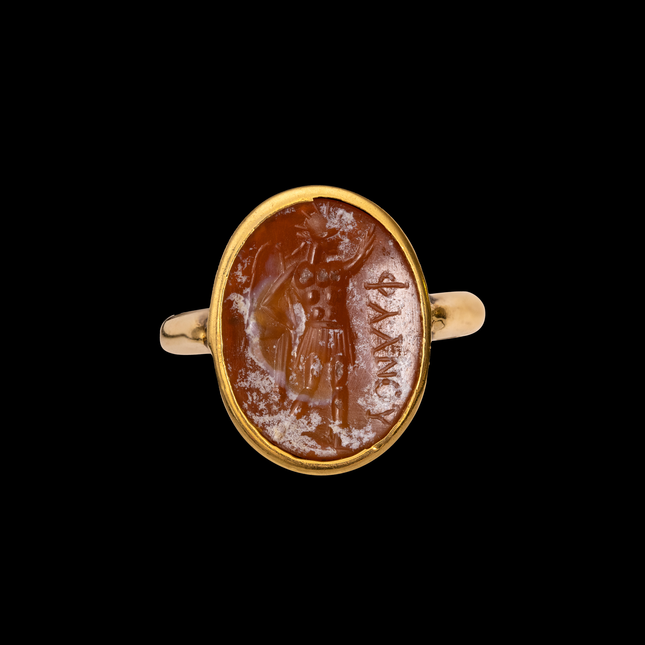 A gold ring set with a Roman carnelian intaglio. Sol Invictus. (2nd - 3rd century A.D.)