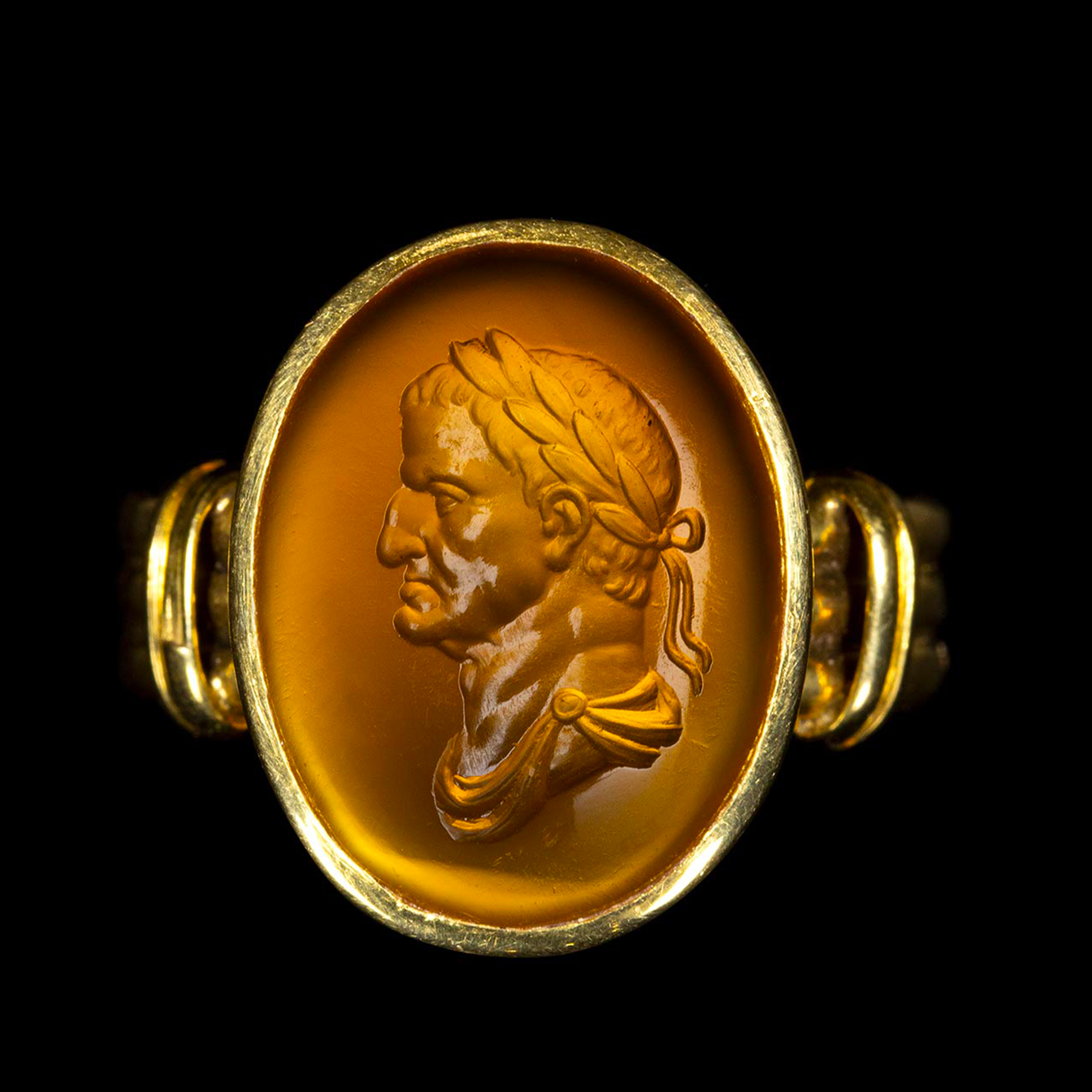 A gold ring set with a 18th century carnelian intaglio. Bust of Galba (reign 68-69 A.D.)