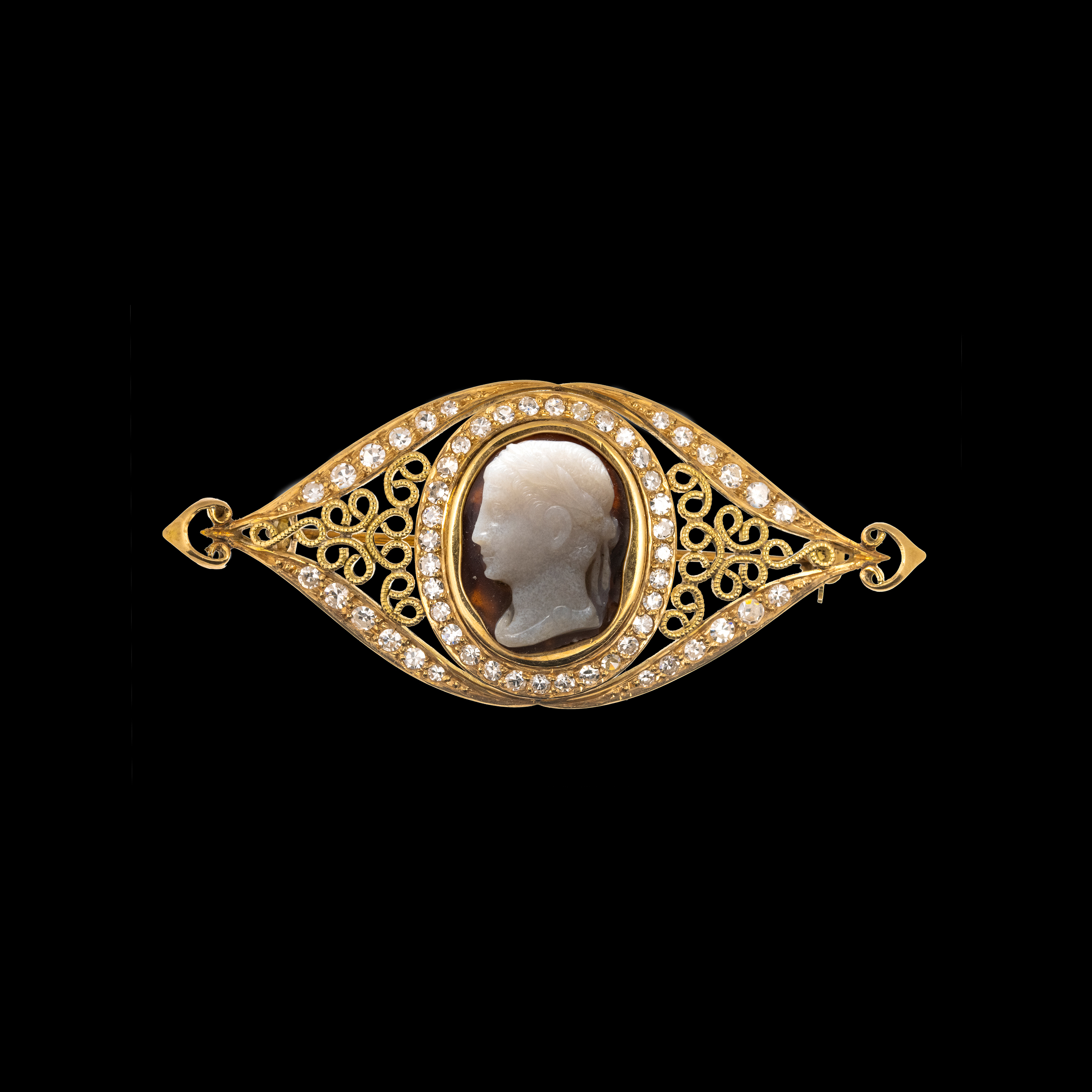 A Late 19th century gold brooch with diamonds and set with a central agate cameo. Head of an Emperor. 