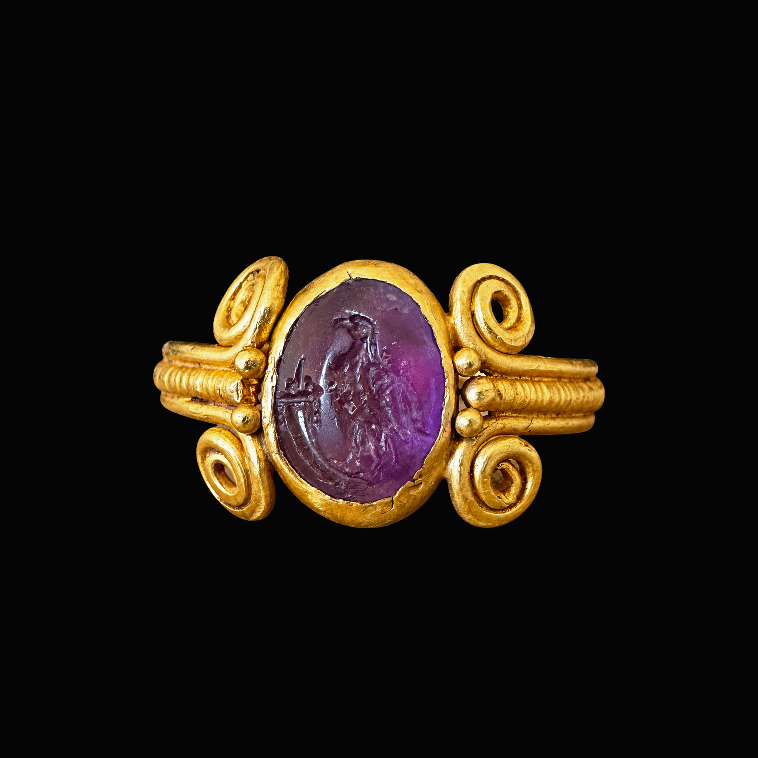 Intaille romaine en améthyste montée sur une bague en or de l'Antiquité tardive. Aigle à la corne d'abondance.