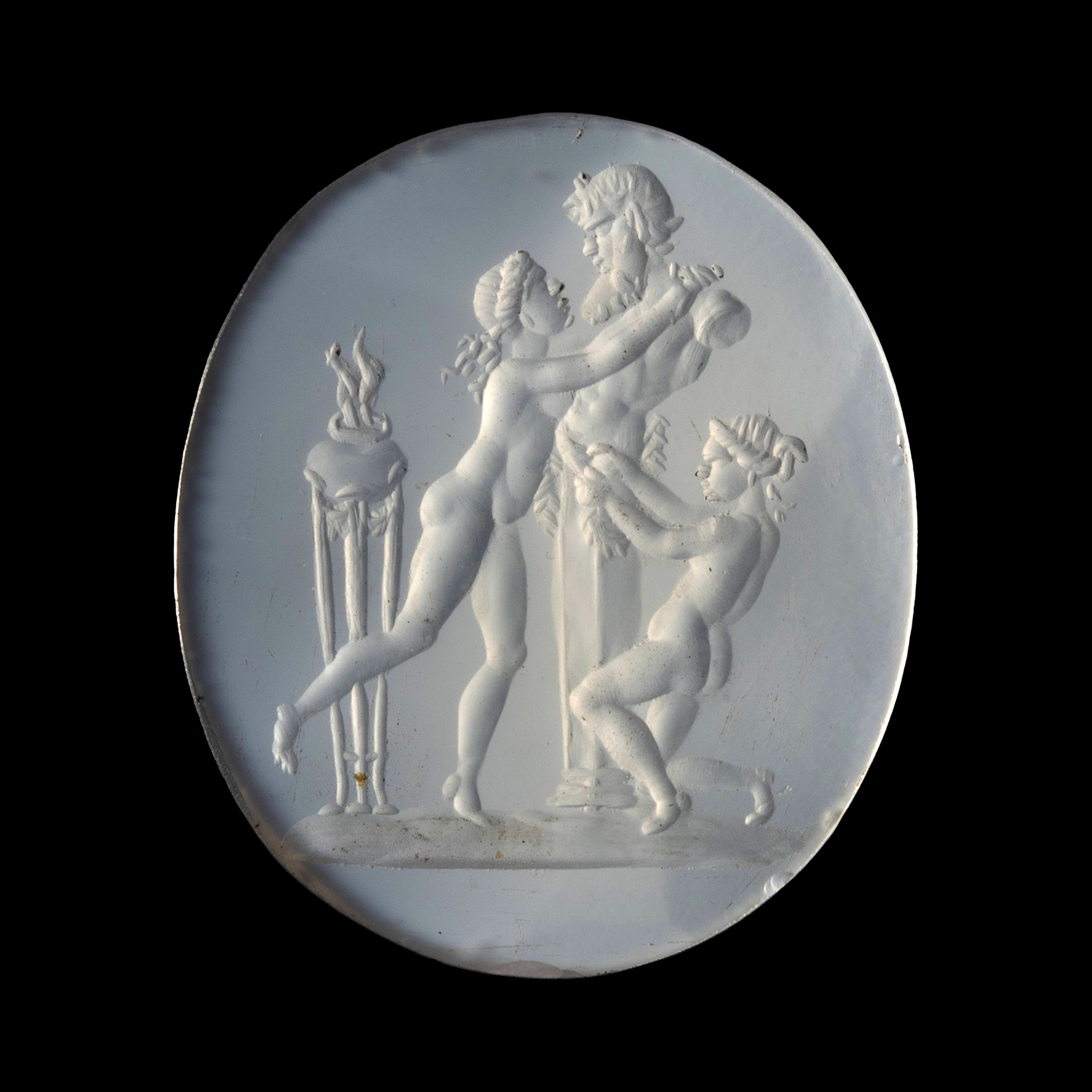 A 18th/19th century chalcedony intaglio depicting a priapic scene.