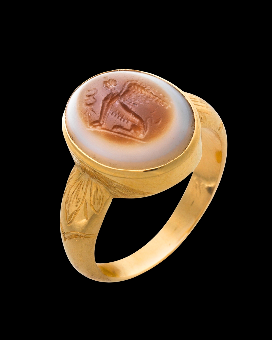 A 19th Century Gold Chiseled Signet Ring set with a Roman Sardonyx Intaglio — Sphinx with Caduceus